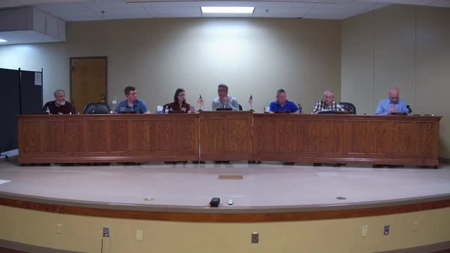 Community voices opposition to solar farm's economic claims during meeting